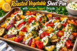Roasted Vegetable Sheet Pan with colorful roasted zucchini, bell peppers, tomatoes, broccoli, eggplant, red onion, and lemon yogurt drizzle